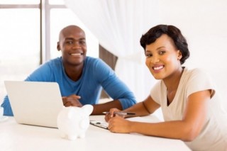 young african couple paying bills young african couple paying bills
