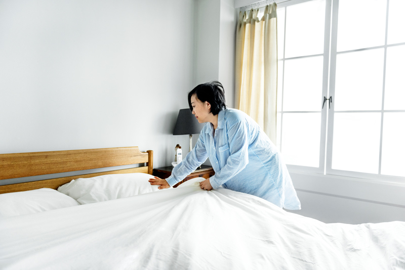 woman-making-bed woman-making-bed